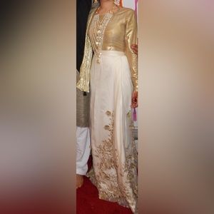 Gold and white lehnga dress with flowers
